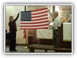 Veteran's Day 2014- Veteran's Mike and Pat Reher hold up the American Flag while the congregation sings "Battle Hymn of the Republic"