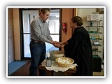 Pastor Lesley washes hands and blesses everyone as they enter for the Seder meal on Maundy Thursday.